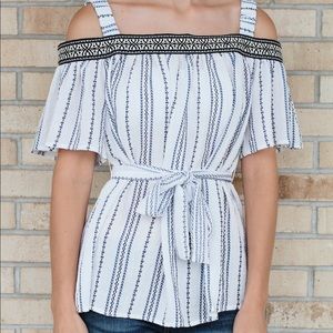 Cold shoulder top with tie waist.